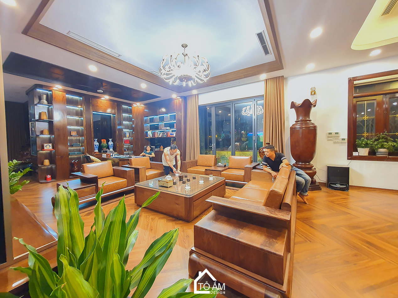 Phòng khách Penthouse Gỗ Tự Nhiên, Gỗ óc chó Sang Trọng - Hoàn thiện công trình Penthouse Gỗ Tự Nhiên chú Vui tại Hòa Lạc - Tổ Ấm Design