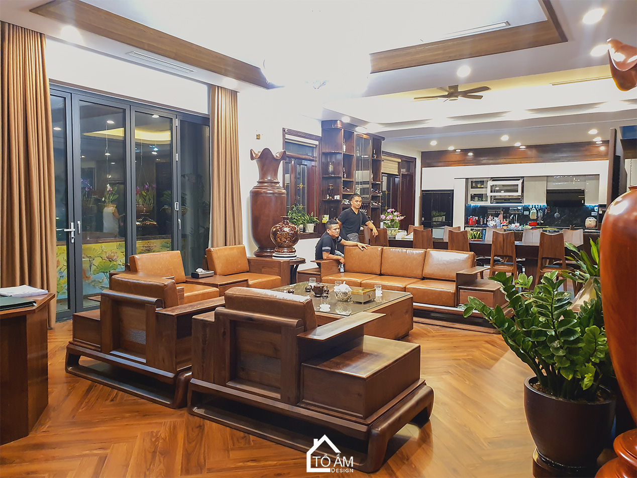 Phòng khách Penthouse Gỗ Tự Nhiên, Gỗ óc chó Sang Trọng - Hoàn thiện công trình Penthouse Gỗ Tự Nhiên chú Vui tại Hòa Lạc - Tổ Ấm Design